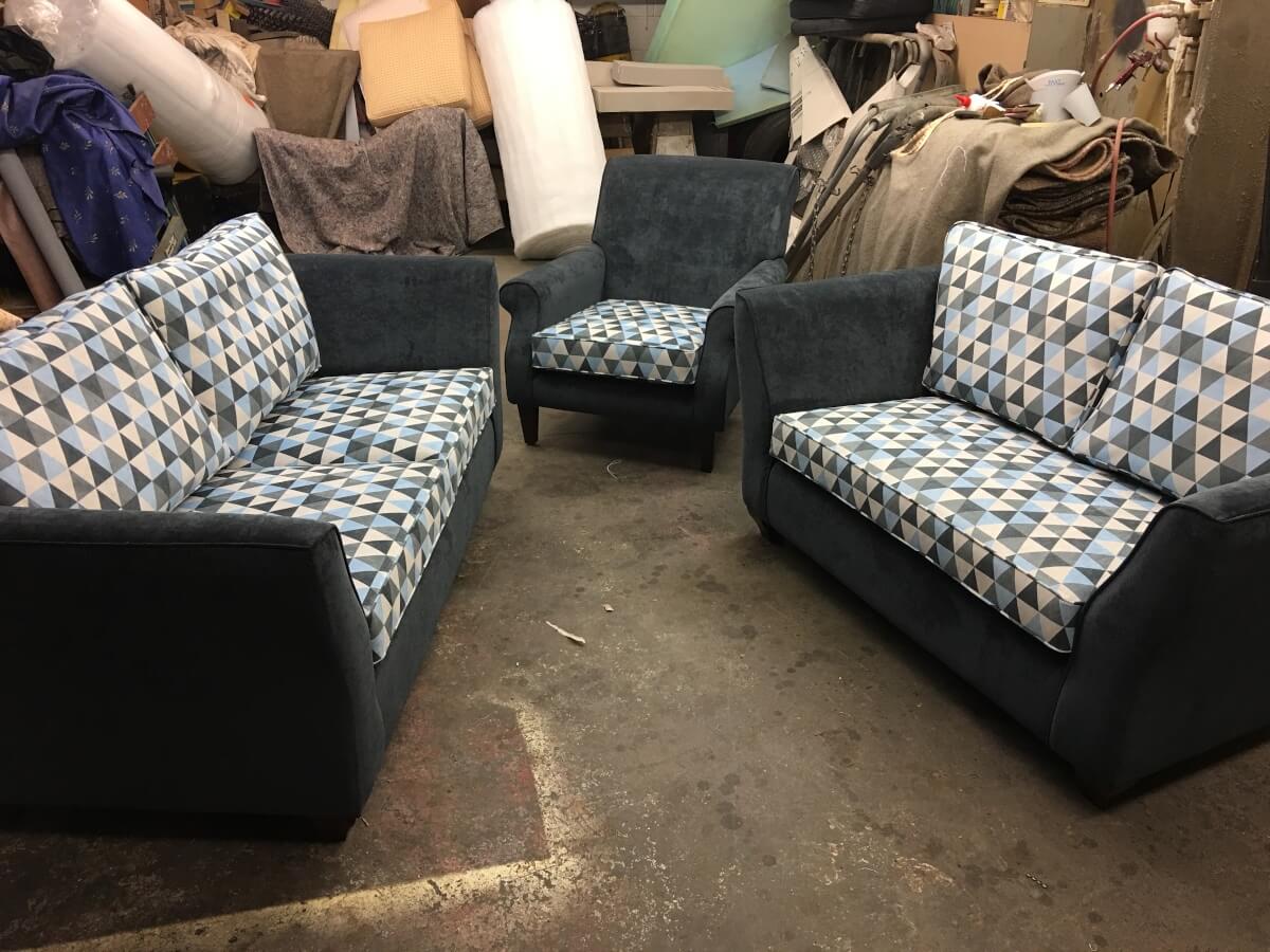 Sofas and chairs in upholstery workshop, Leicester