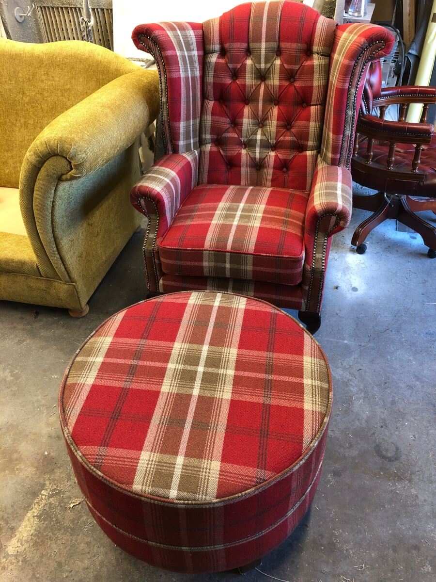 Armchair and footstool in upholstery workshop, Leicester